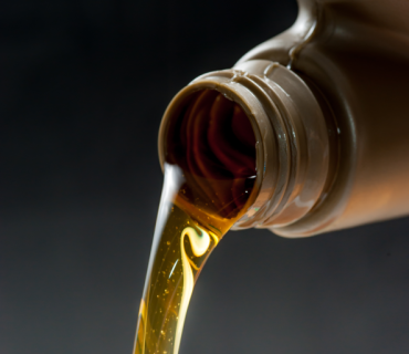 pouring-engine-oil-from-its-plastic-container